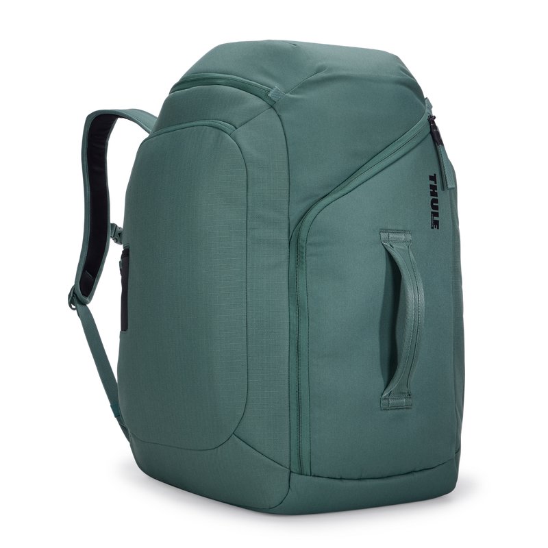 Thule RoundTrip Boot Backpack 60L in hazy green, front view with side handle